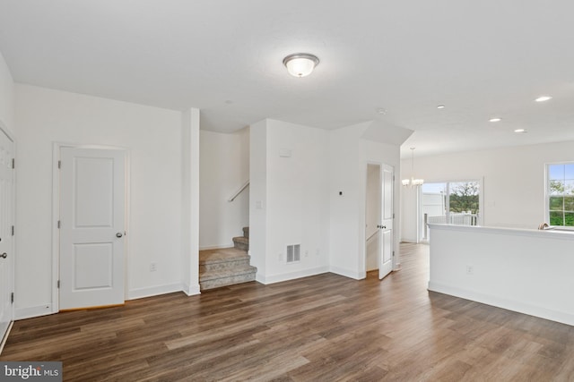 199 Holstein Dr Unit 117, Hanover, PA 17331 - unfurnished living room with visible vents, wood finished floors, baseboards, a notable chandelier, and recessed lighting