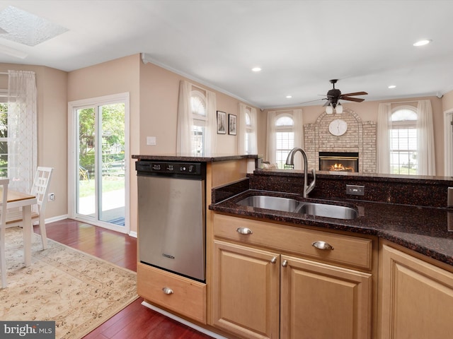 2322 Golden Chapel Rd, Odenton, MD 21113 - kitchen featuring stainless steel dishwasher, dark wood-style flooring, ceiling fan, dark stone counters, and a sink
