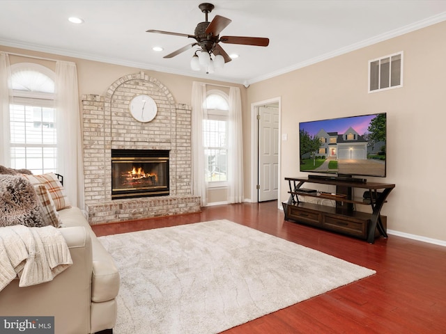 2322 Golden Chapel Rd, Odenton, MD 21113 - living area featuring a ceiling fan, visible vents, a healthy amount of sunlight, and wood finished floors
