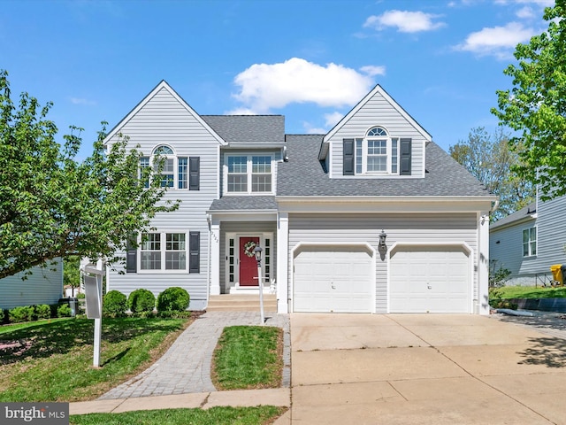2322 Golden Chapel Rd, Odenton, MD 21113 - traditional home featuring an attached garage, a shingled roof, and driveway