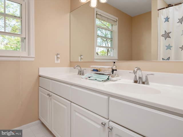 2322 Golden Chapel Rd, Odenton, MD 21113 - bathroom with a sink, baseboards, tile patterned flooring, and double vanity