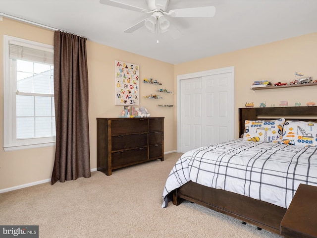 2322 Golden Chapel Rd, Odenton, MD 21113 - carpeted bedroom featuring a closet, baseboards, ceiling fan, and multiple windows