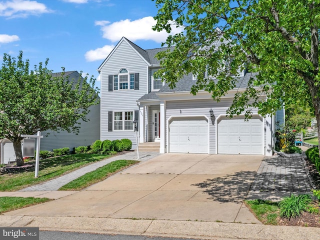 2322 Golden Chapel Rd, Odenton, MD 21113 - traditional-style home with an attached garage, roof with shingles, and concrete driveway