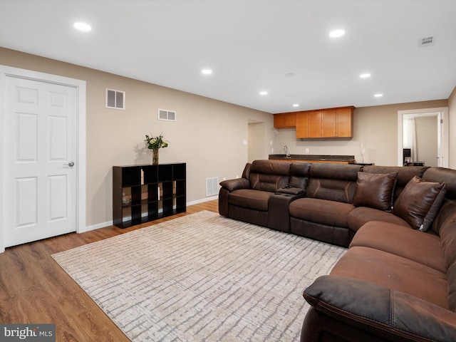 2322 Golden Chapel Rd, Odenton, MD 21113 - living area featuring wet bar, visible vents, and wood finished floors
