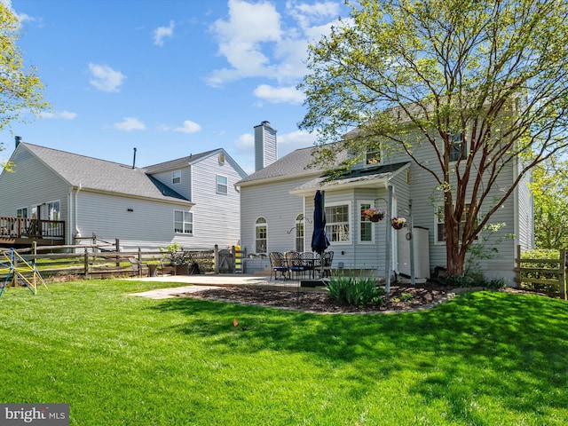 2322 Golden Chapel Rd, Odenton, MD 21113 - back of house with a lawn, a patio, and fence