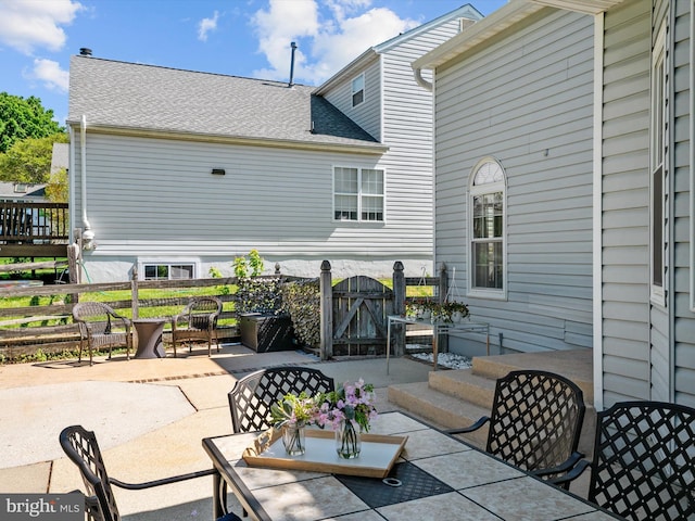 2322 Golden Chapel Rd, Odenton, MD 21113 - view of patio featuring fence, a gate, and outdoor dining space
