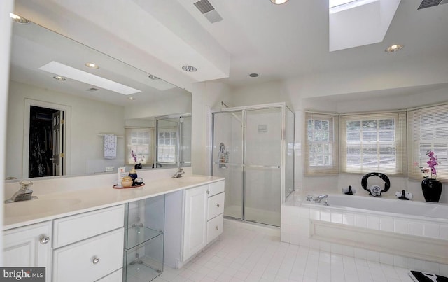 full bath with a stall shower, tile patterned flooring, a sink, and recessed lighting