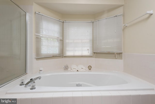 bathroom with a garden tub