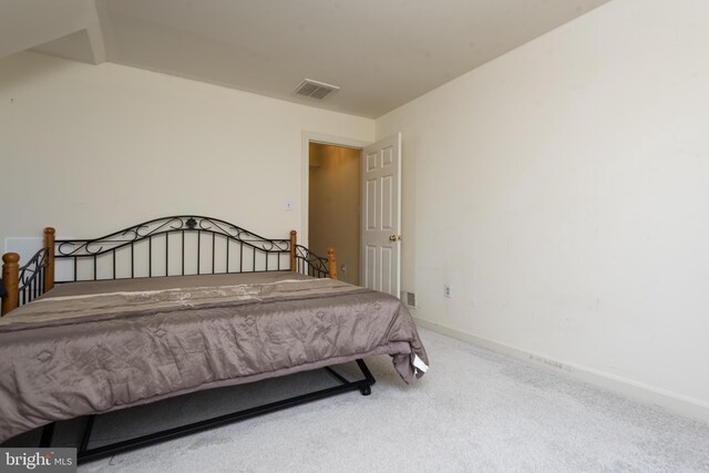 bedroom with baseboards, visible vents, and carpet flooring