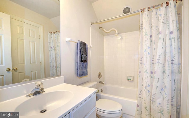 bathroom with shower / bathtub combination with curtain, toilet, and vanity