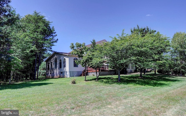 view of yard featuring a wooden deck