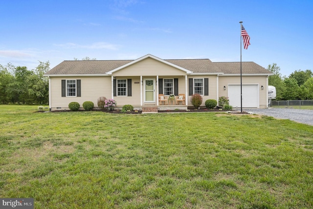 ranch-style home with driveway, fence, an attached garage, a front yard, and a porch