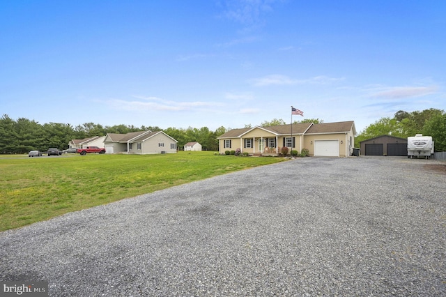 ranch-style house featuring a front lawn, driveway, and a garage