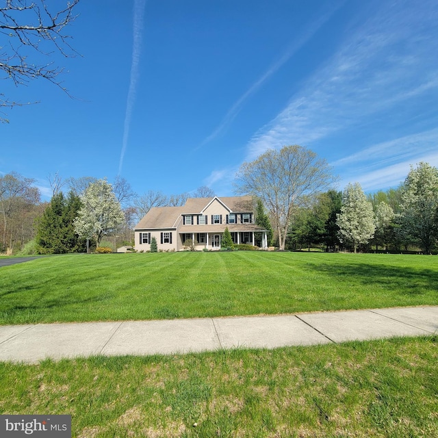 view of front of property with a front lawn