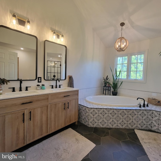 bathroom featuring tile patterned flooring, double vanity, vaulted ceiling, a bath, and a sink