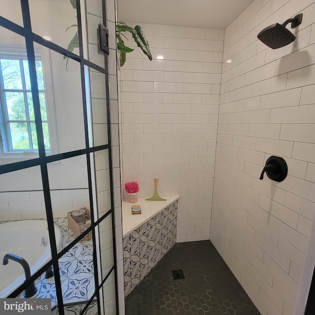 bathroom with a tile shower