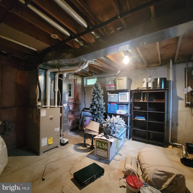 below grade area featuring heating unit