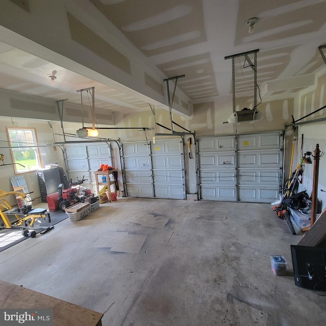 garage featuring a garage door opener