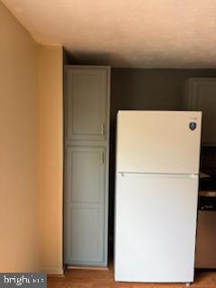 22 Morning Ct, Rosedale, MD 21237 - kitchen with freestanding refrigerator and light wood-style flooring