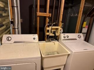 22 Morning Ct, Rosedale, MD 21237 - washroom with laundry area, washer and clothes dryer, and a sink