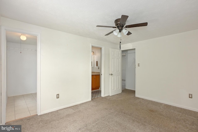 22 Morning Ct, Rosedale, MD 21237 - unfurnished bedroom featuring a walk in closet, baseboards, carpet floors, a closet, and ensuite bath