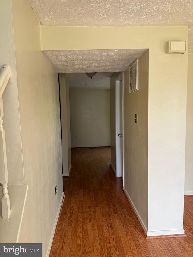 22 Morning Ct, Rosedale, MD 21237 - hallway with baseboards, a textured ceiling, visible vents, and wood finished floors