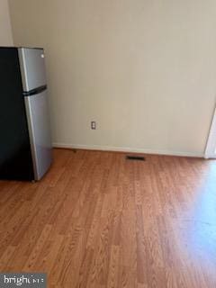 22 Morning Ct, Rosedale, MD 21237 - unfurnished dining area featuring baseboards and wood finished floors