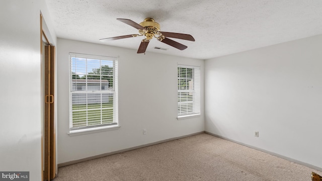412 Trimblefields Dr, Edgewood, MD 21040 - carpeted empty room featuring a ceiling fan, baseboards, and a textured ceiling