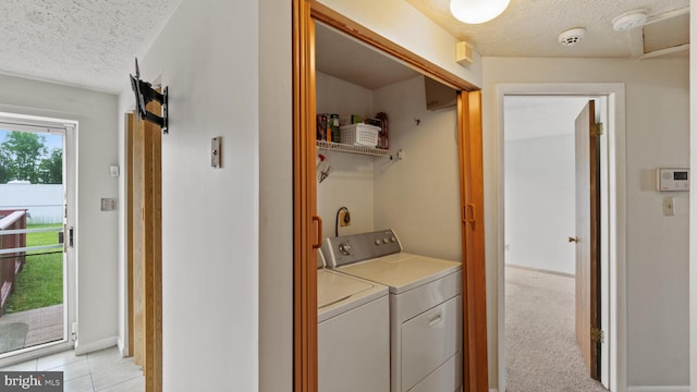 412 Trimblefields Dr, Edgewood, MD 21040 - laundry room featuring washer and dryer, a textured ceiling, light tile patterned floors, and baseboards