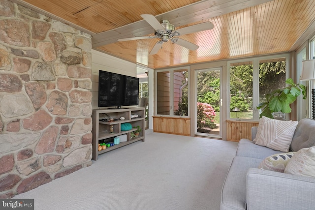 carpeted living area featuring ceiling fan and wooden ceiling