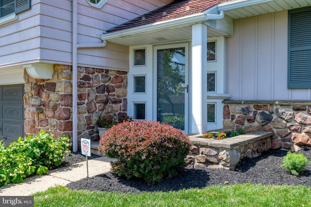 exterior space with stone siding