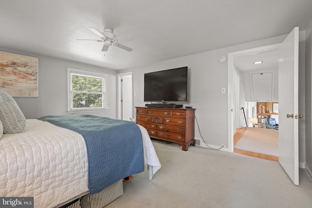 carpeted bedroom with ceiling fan