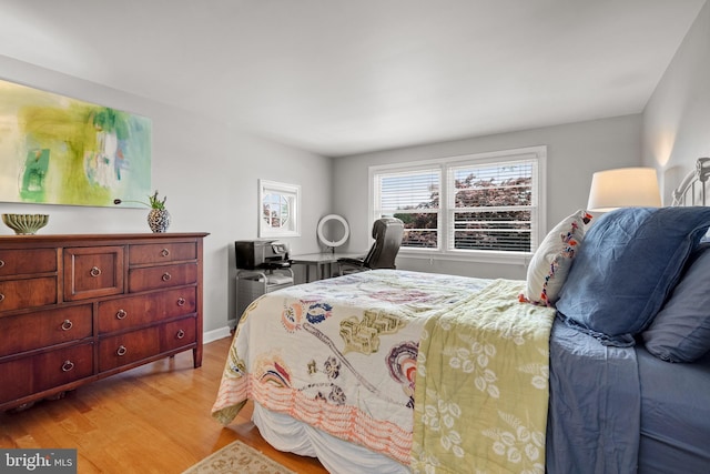 bedroom featuring light wood-style flooring