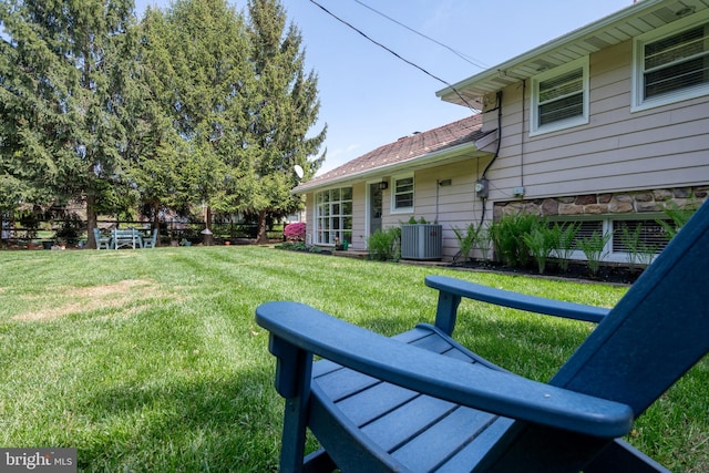 view of yard featuring central AC unit