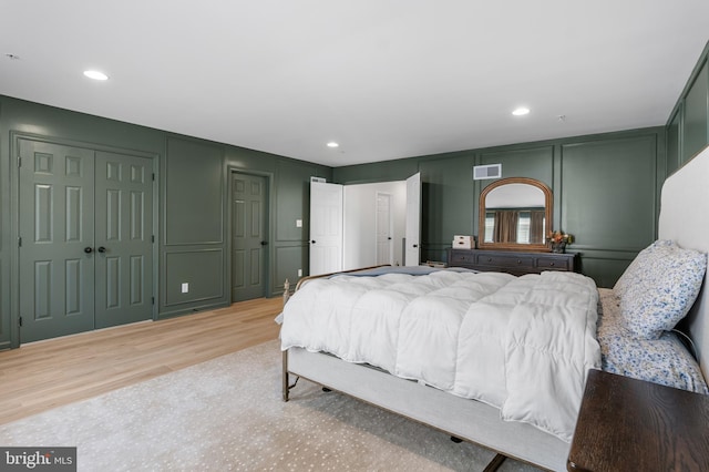 194 Cool Springs Road, North East, MD 21901 - bedroom with visible vents, recessed lighting, light wood-style floors, and a decorative wall