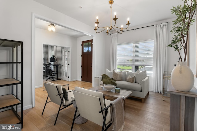 194 Cool Springs Road, North East, MD 21901 - living room featuring a chandelier, baseboards, and light wood-style floors