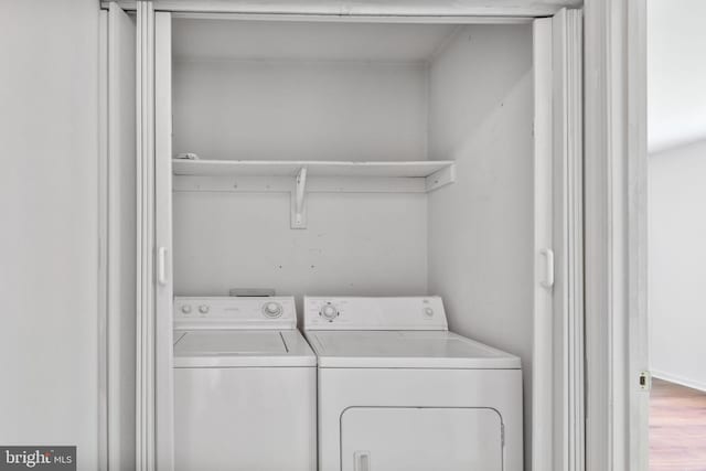 laundry area with separate washer and dryer and laundry area