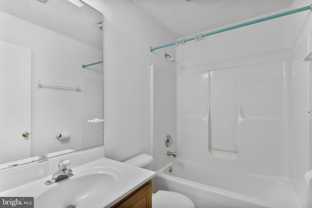 bathroom featuring shower / bath combination, vanity, and toilet