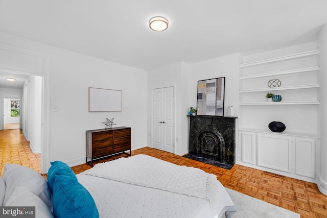 1524 5th St NW, Washington, DC 20001 - bedroom with a fireplace with flush hearth, baseboards, and visible vents