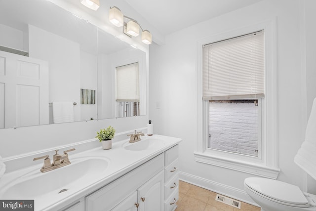 1524 5th St NW, Washington, DC 20001 - bathroom with visible vents, a sink, baseboards, and tile patterned flooring
