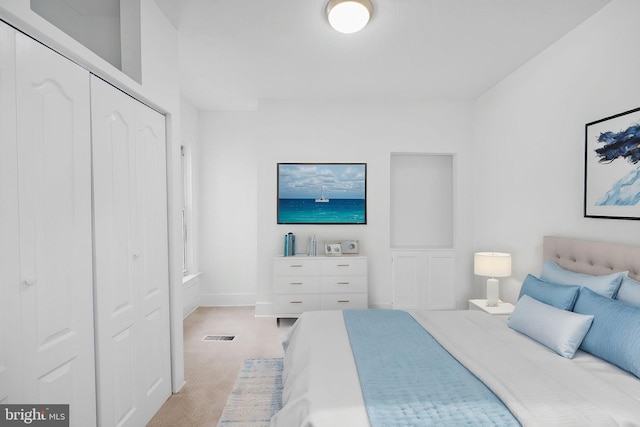 1524 5th St NW, Washington, DC 20001 - bedroom featuring light colored carpet, baseboards, and a closet