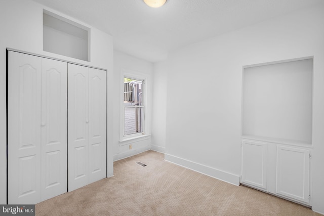 1524 5th St NW, Washington, DC 20001 - unfurnished bedroom featuring baseboards, light carpet, a closet, and visible vents