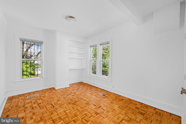 1524 5th St NW, Washington, DC 20001 - empty room featuring plenty of natural light, baseboards, visible vents, and built in shelves