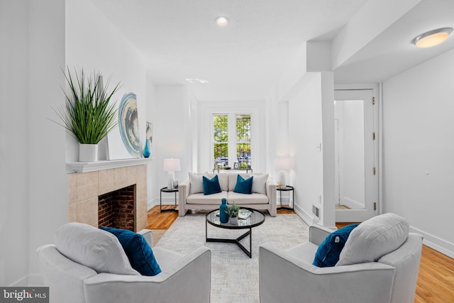 1524 5th St NW, Washington, DC 20001 - living room featuring baseboards, visible vents, wood finished floors, and a fireplace
