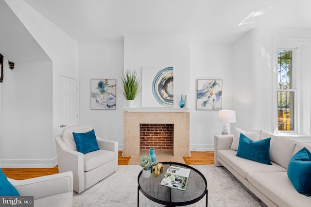 1524 5th St NW, Washington, DC 20001 - living room with baseboards, wood finished floors, and a tiled fireplace
