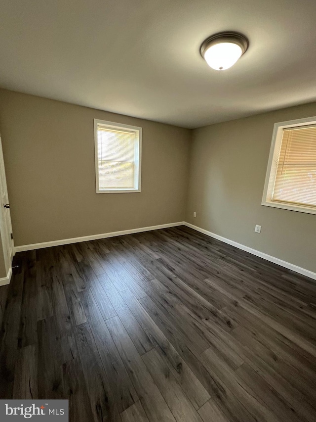 1948 Victory Dr, Baltimore, MD 21227 - spare room featuring baseboards and dark wood-style floors