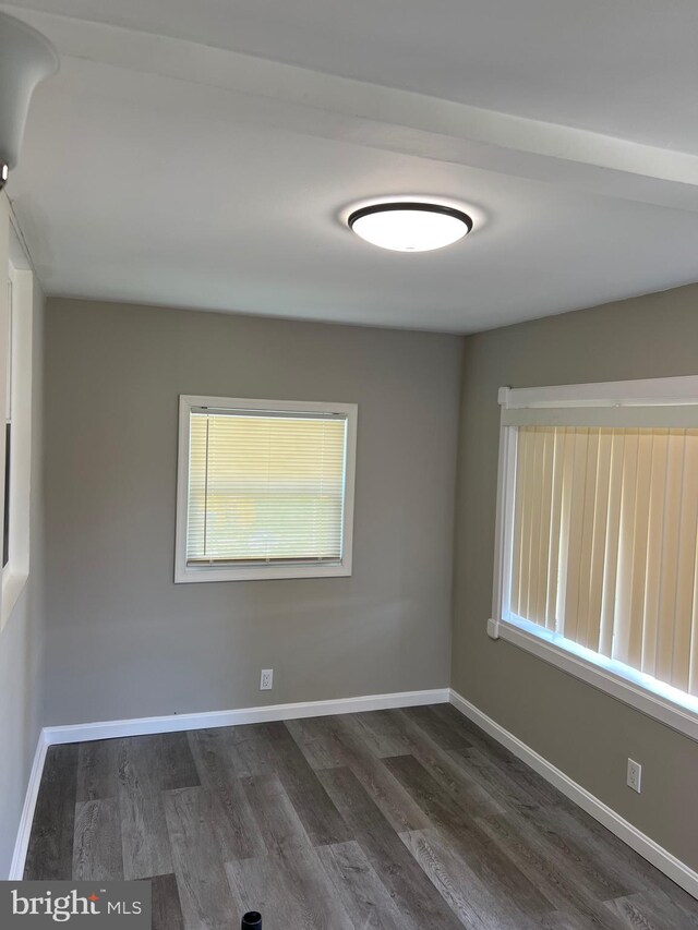1948 Victory Dr, Baltimore, MD 21227 - empty room featuring baseboards and wood finished floors