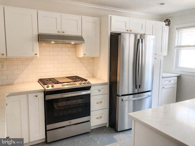kitchen with stainless steel appliances, white cabinetry, decorative backsplash, under cabinet range hood, and ornamental molding