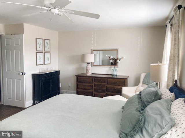 bedroom with baseboards and ceiling fan