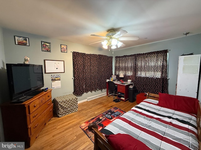 bedroom with ceiling fan and light wood-type flooring